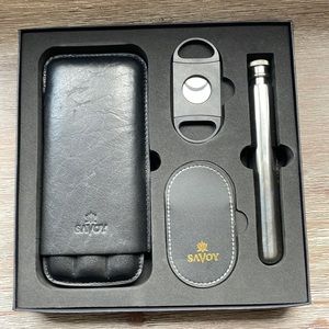 Cigar gift box. Includes cigar pouch/holder, cutter, and two other items. Gift.
